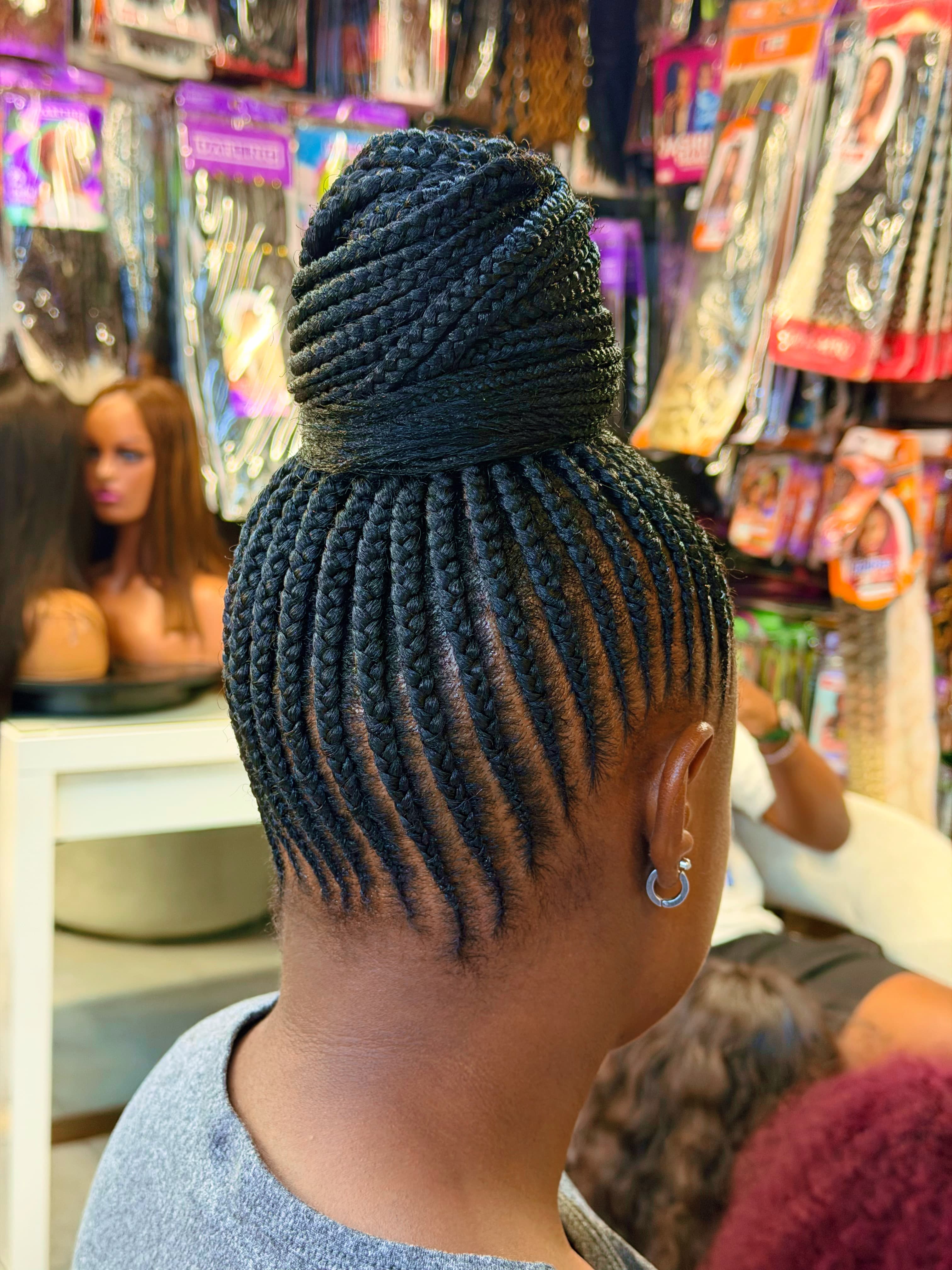 Box Braid Bun — Knotless & box braids by Qasr Alshar Salon, Dubai — gentle, protective styling for Afro-textured hair near Union Metro, Deira.